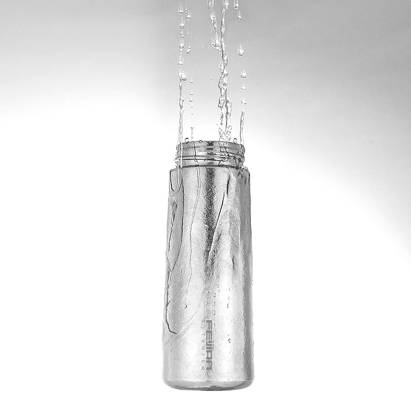titanium water bottle with water
